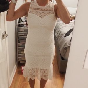 White knee length lace dress with ruffled bottom